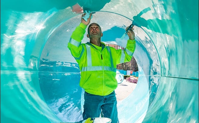 Construction workers assembling slide pieces at Water Country USA