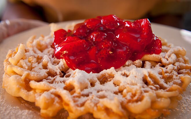 Endulge in funnel cake for a sweet theme park treat