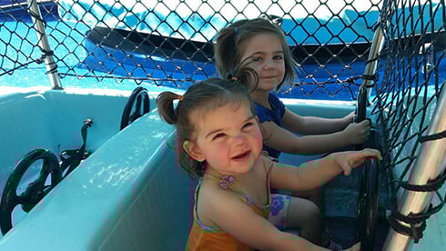Land of the Dragons includes kids rides, tree house, climbing ropes, slides, and a water play area.