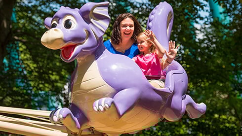 Land of the Dragons includes kids rides, tree house, climbing ropes, slides, and a water play area.